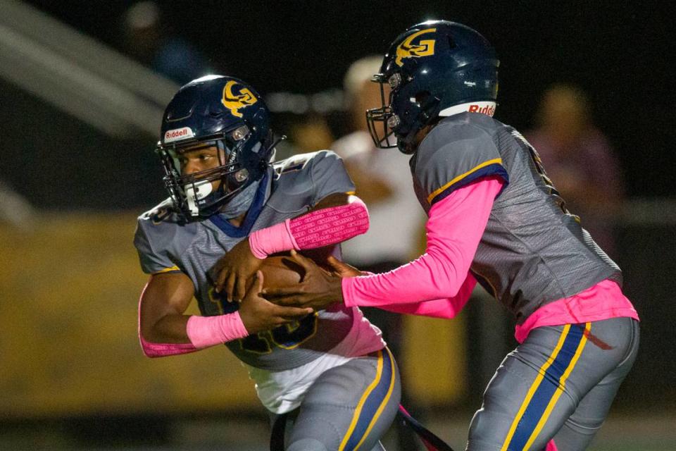 Gautier quarterback Kelvin Beavers hands a pass off to Solomon Baggett during a game against East Central at Gautier High School in Gautier on Friday, Oct. 20, 2023.