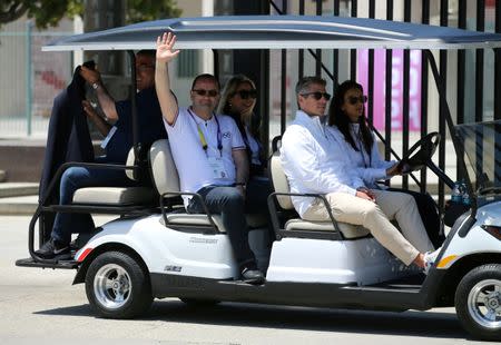 International Olympic Committee Evaluation Commission Chairman Patrick Baumann waves as he rides in a golf cart following a tour of the Los Angeles Memorial Coliseum as part of LA 2024 bid for the Summer 2024 Olympic Games in Los Angeles, California, U.S., May 11, 2017. REUTERS/Mike Blake