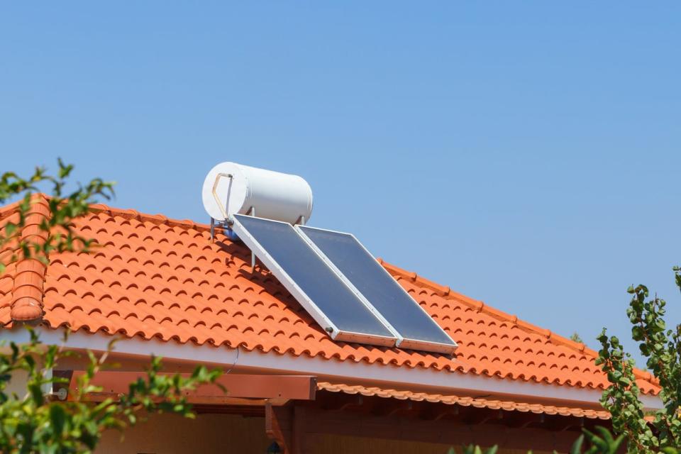 orange roof top with solar panel and water heater 