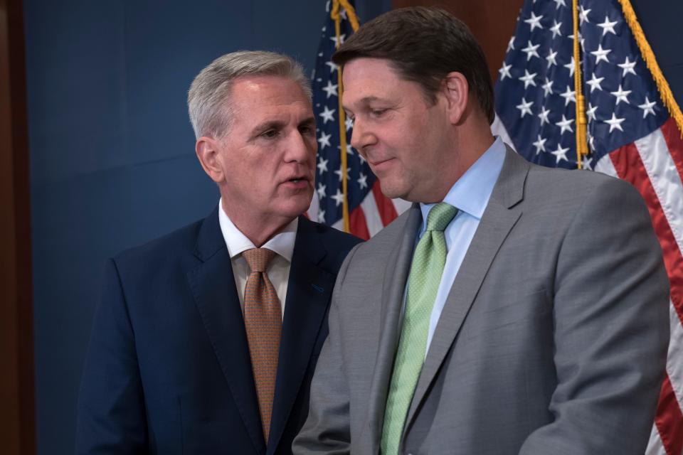 Speaker of the House Kevin McCarthy, R-Calif., left, confers with House Budget Committee Chairman Jodey Arrington, R-Texas, as Republican leaders meet with reporters following a closed-door briefing on the budget that will be submitted by President Joe Biden, at the Capitol in Washington, Wednesday, March 8, 2023.