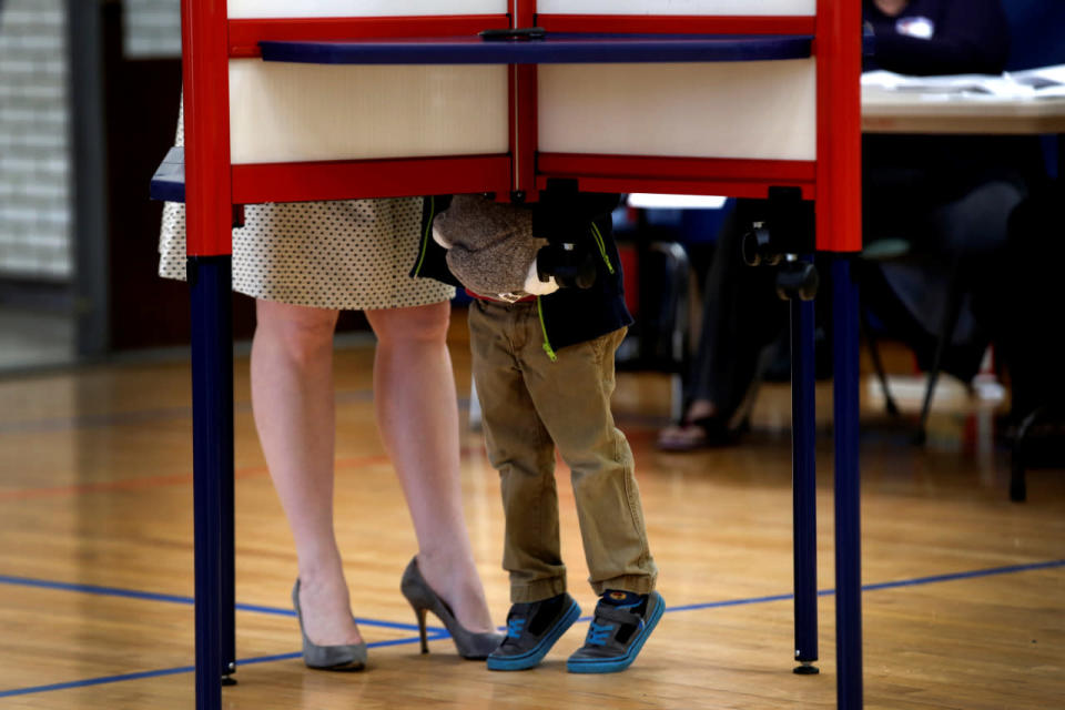 A Chappaqua resident votes with her son