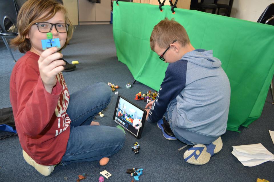Gage Nelson and Jaden Franke, Lake Center fifth-graders, create a movie with Legos and a green screen as part of Future Ready Learning Week at the school.