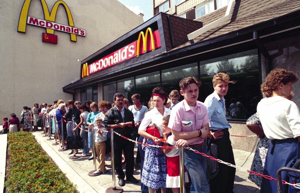 FILE - Russians wait in line outside a McDonald's fast food restaurant in Moscow in 1991. Two months after the Berlin Wall fell, another powerful symbol opened its doors in the middle of Moscow: a gleaming new McDonald’s. It was the first American fast-food restaurant to enter the Soviet Union. But now, McDonald's is temporarily closing its 850 restaurants in Russia in response to the Ukraine invasion. (AP Photo/File)