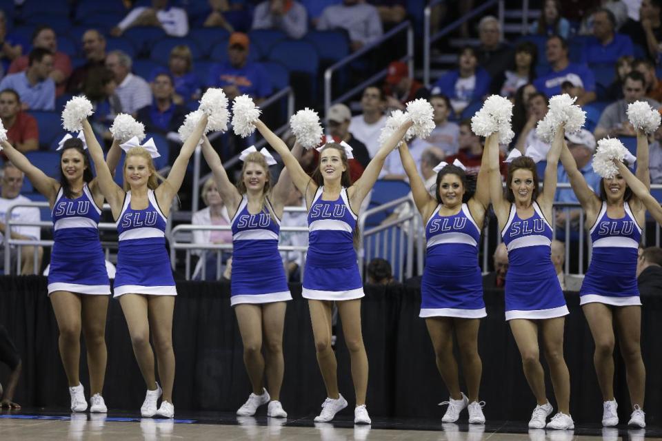 Saint Louis cheerleaders perform during the first half against North Carolina State in a second-round game in the NCAA college basketball tournament Thursday, March 20, 2014, in Orlando, Fla. (AP Photo/John Raoux)