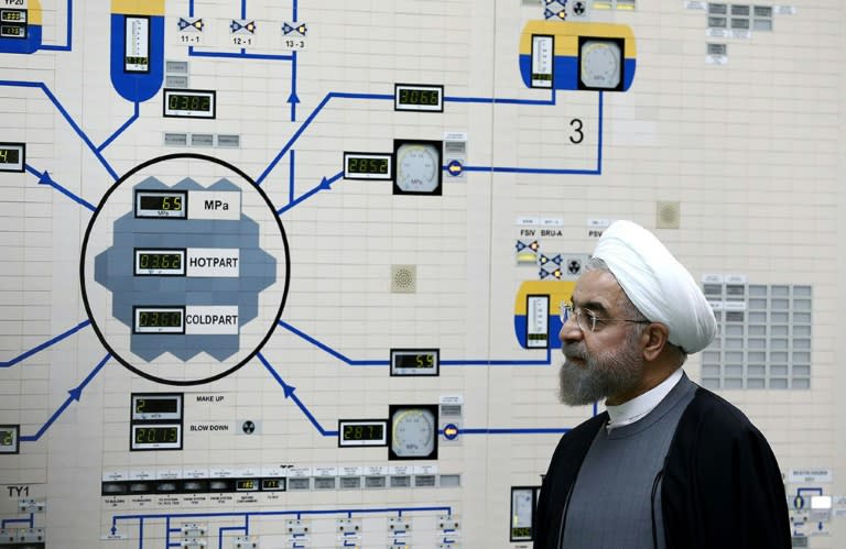 Iranian President Hassan Rouhani visits the control room of the Bushehr nuclear power plant in the Gulf port city of Bushehr on January 13, 2015