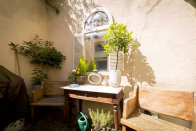 <p>The outside also has a picturesque courtyard. (Airbnb) </p>