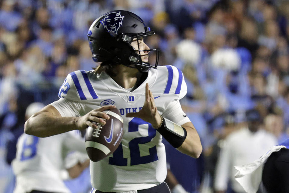 Duke quarterback Grayson Loftis (12) looks to pass against North Carolina during the first half of an NCAA college football game Saturday, Nov. 11, 2023, in Chapel Hill, N.C. (AP Photo/Chris Seward)