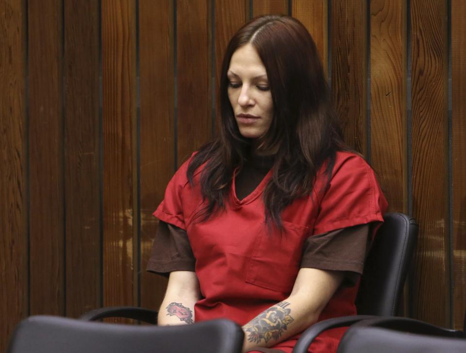 Alix Catherine Tichelman sits in the courtroom during her arraignment in Santa Cruz, California July 16, 2014. Tichelman, 26, was arrested earlier this month in connection with the November 2013 death of Forrest Hayes, an executive at Google Inc and a father of five. Tichelman faces eight charges including manslaughter, transporting and possessing heroin, prostitution and destruction of evidence. REUTERS/Robert Galbraith (UNITED STATES - Tags: CRIME LAW SCIENCE TECHNOLOGY)