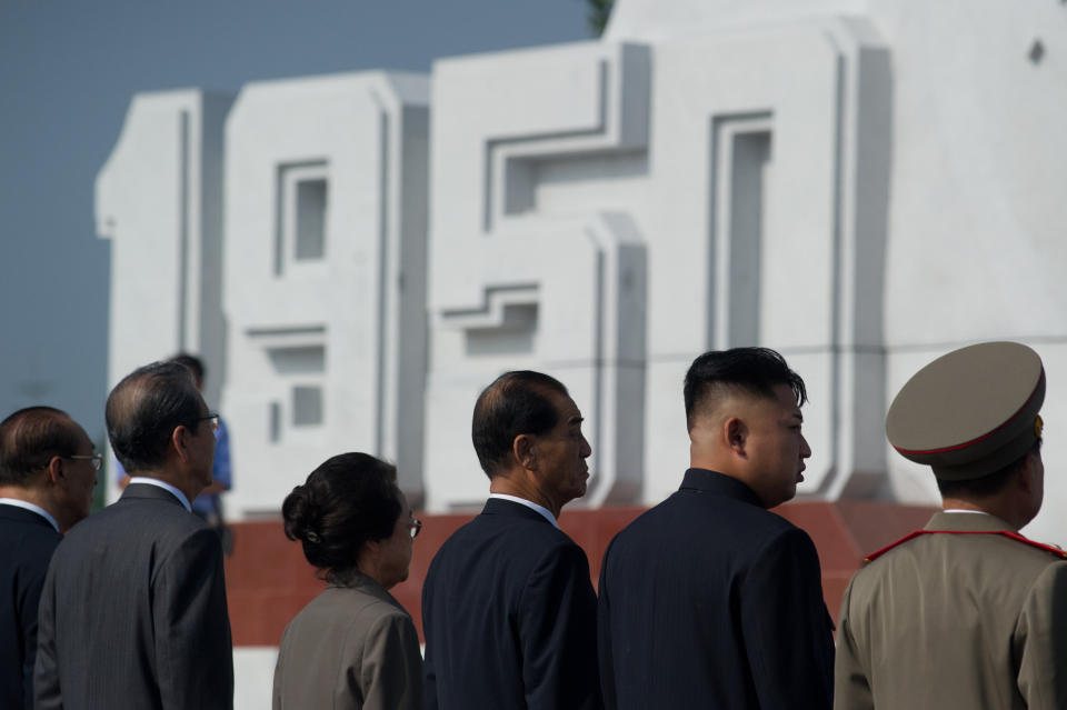 North Korean leader Kim Jong-Un (2nd R) arrives to attend the inauguration of a Korean war military cemetery in Pyongyang on July 25, 2013. (Ed Jones/AFP/Getty Images)