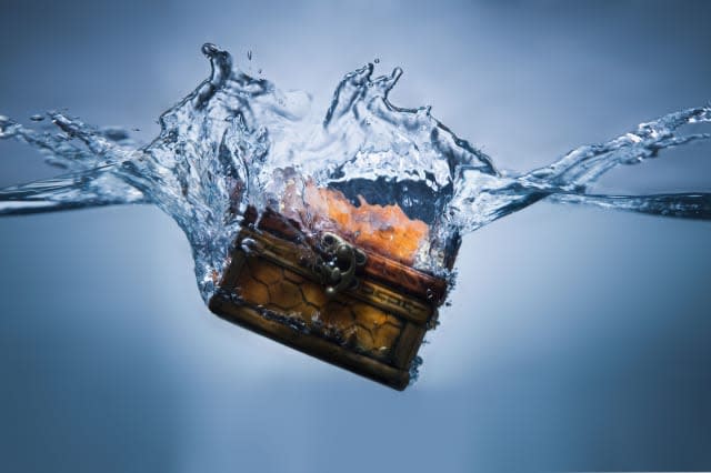 BMHPW6 Treasure chest sinking in water. Image shot 2010. Exact date unknown.  Chest; Money; Sinking; Splash; Treasure; Water; Bl