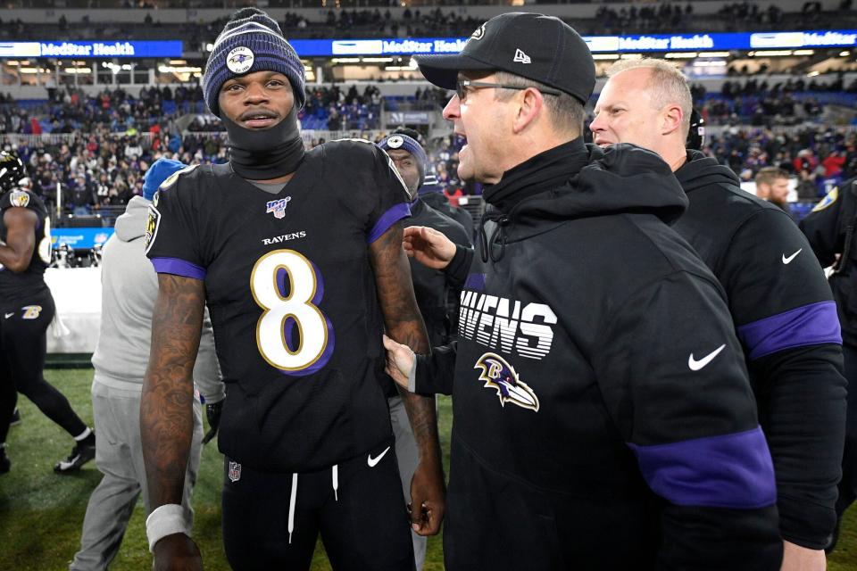 Baltimore Ravens quarterback Lamar Jackson (8) talks with head coach John Harbaugh, right, after an NFL football game against the New York Jets, in Baltimore. The Ravens won 42-21 Jets Ravens Football, Baltimore, USA - 12 Dec 2019