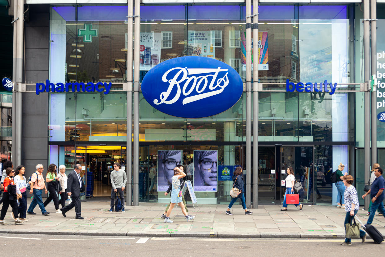 People walking in front of the Boots pharmacy on Oxford Street, London. Oxford Street is one of the most famous shopping streets in the London. (Getty Images)