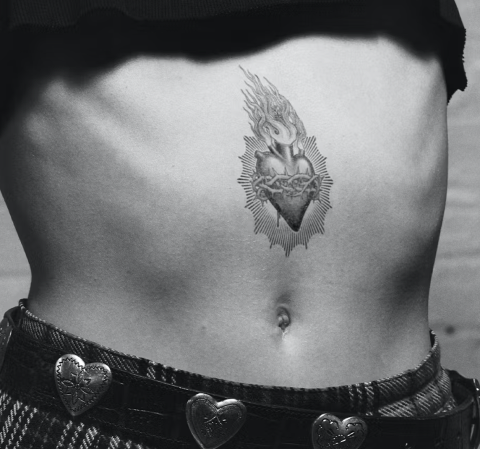 model wearing heart with flames temporary tattoo on stomach