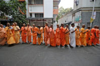 Hindu holy men stand in a queue outside a polling station to caste their vote during the final phase of general election in Kolkata, India, May 19, 2019. REUTERS/Rupak De Chowdhuri