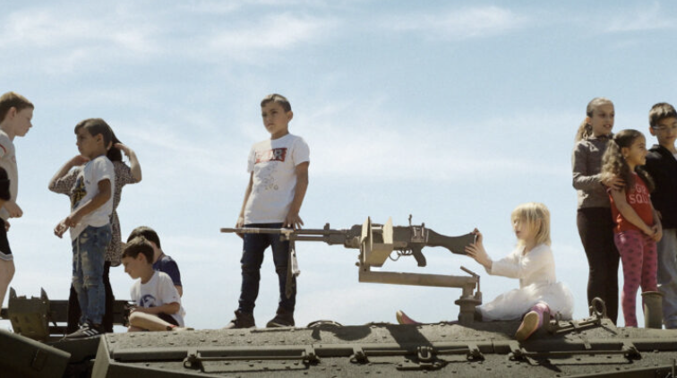 Israeli children play with military equipment in 'Innocence'