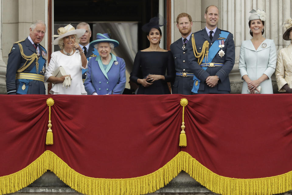 FILE - In this Tuesday, July 10, 2018 file photo, members of the royal family gather on the balcony of Buckingham Palace, with from left, Prince Charles, Camilla the Duchess of Cornwall, Prince Andrew, Queen Elizabeth II, Meghan the Duchess of Sussex, Prince Harry, Prince William and Kate the Duchess of Cambridge, as they watch a flypast of Royal Air Force aircraft pass over Buckingham Palace in London. Prince Harry and his wife, Meghan, are fulfilling their last royal commitment Monday March 9, 2020 when they appear at the annual Commonwealth Service at Westminster Abbey. It is the last time they will be seen at work with the entire Windsor clan before they fly off into self-imposed exile in North America. (AP Photo/Matt Dunham, File)