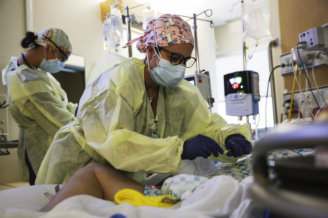 Image: U.S. Army Capt. Corrine Brown, a critical care nurse, administers an anti-viral medication to a Covid-19 patient at Kootenai Health regional medical center in Coeur d'Alene, Idaho, on Sept. 6, 2021. (Michael H. Lehman / DVIDS via AP)