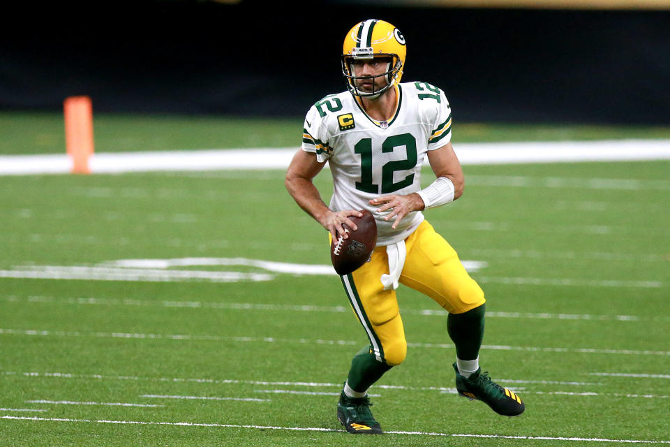 Aaron Rodgers looks to pass against the New Orleans Saints during the first half.