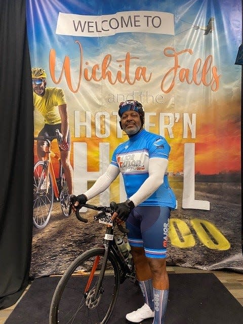 Damian Jackson stands next to his bike at the 2022 Hotter'N Hell race.