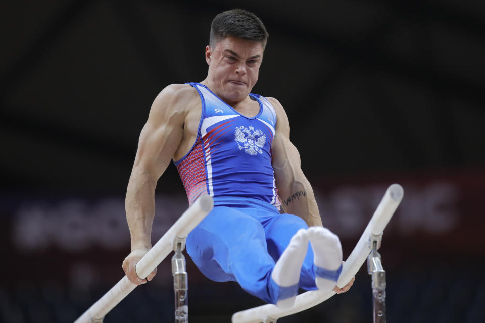 CAPTION CORRECTS THE NAME - Bronze medallist Russia’s Nikita Nagornyy performs on the parellel bars during the Men's All-Around Final of the Gymnastics World Chamionships at the Aspire Dome in Doha, Qatar, Wednesday, Oct. 31, 2018. (AP Photo/Vadim Ghirda)