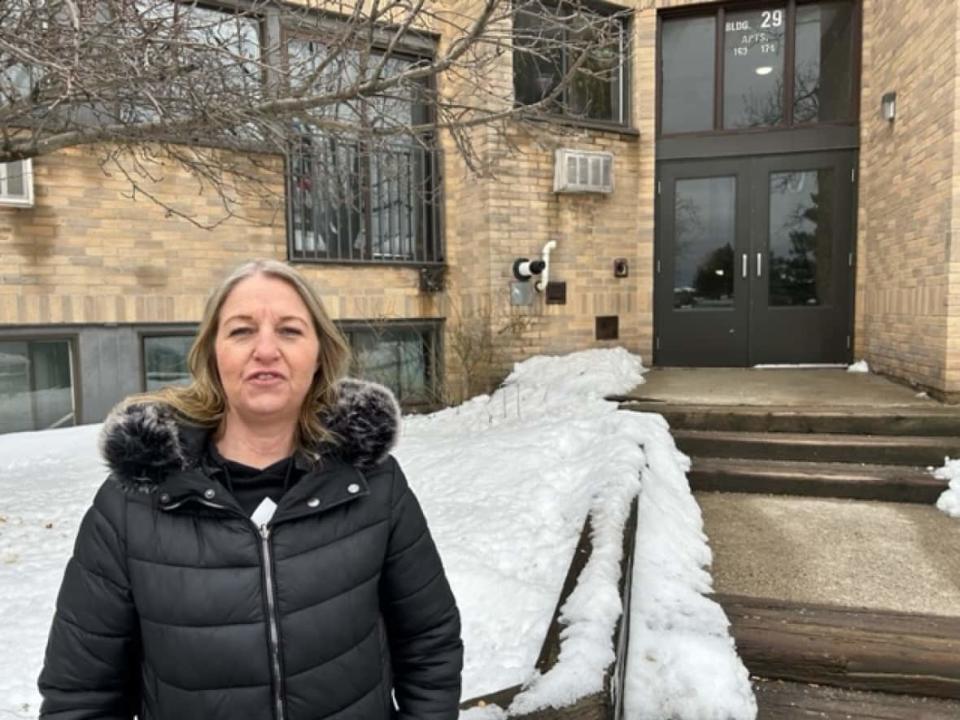April Johnston received a copy of an eviction application on Feb. 23. She says she's terrified of losing her home for speaking out about what she says are deficiencies in the building's upkeep.  (Mike Smee/CBC - image credit)