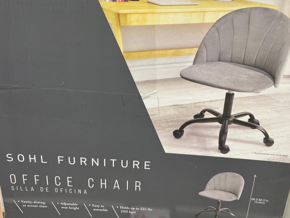 Gray box with a picture of a gray office chair on it. White lettering on the side of the box reads "Sohl Furniture office chair"