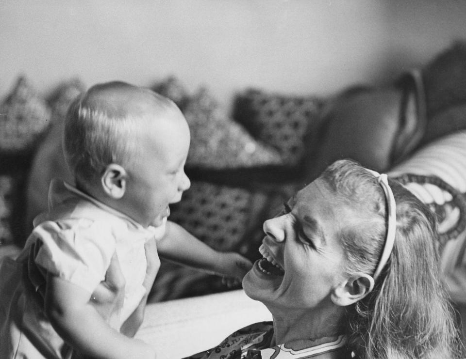 <p>From 1961 until her death in 2014, actress Lauren Bacall lived at the Dakota on the Upper West Side. Here, she's pictured in her apartment with her son, Sam Robards.</p>