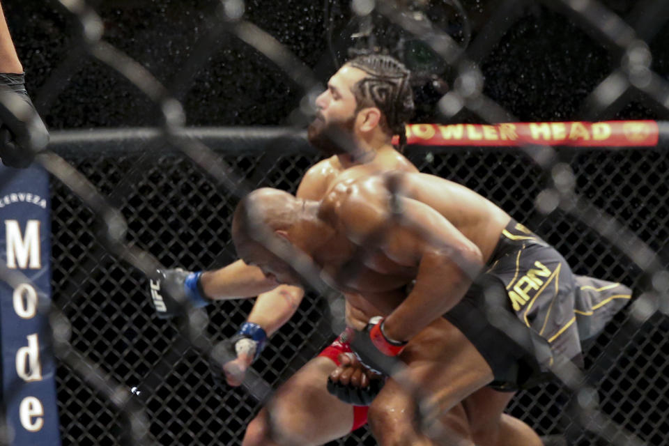 Kamaru Usman knocks out Jorge Masvidal during a UFC 261 mixed martial arts bout early Sunday, April 25, 2021, in Jacksonville, Fla. (AP Photo/Gary McCullough)