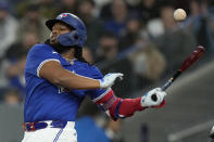 Toronto Blue Jays' Vladimir Guerrero Jr. fouls off a pitch during first-inning baseball game action against the Colorado Rockies in Toronto, Sunday, April 14, 2024. (Frank Gunn/The Canadian Press via AP)