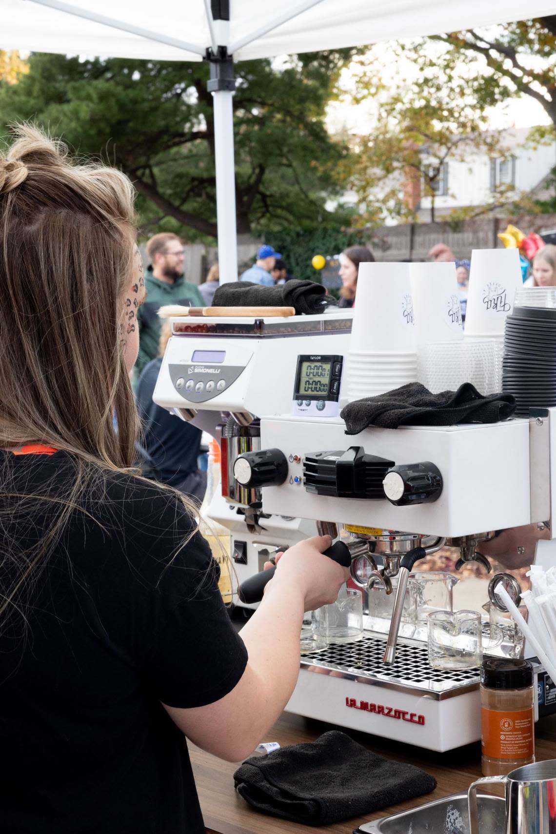 Rachel Larson pulls espresso shots for a busy farmers market crowd every Saturday.