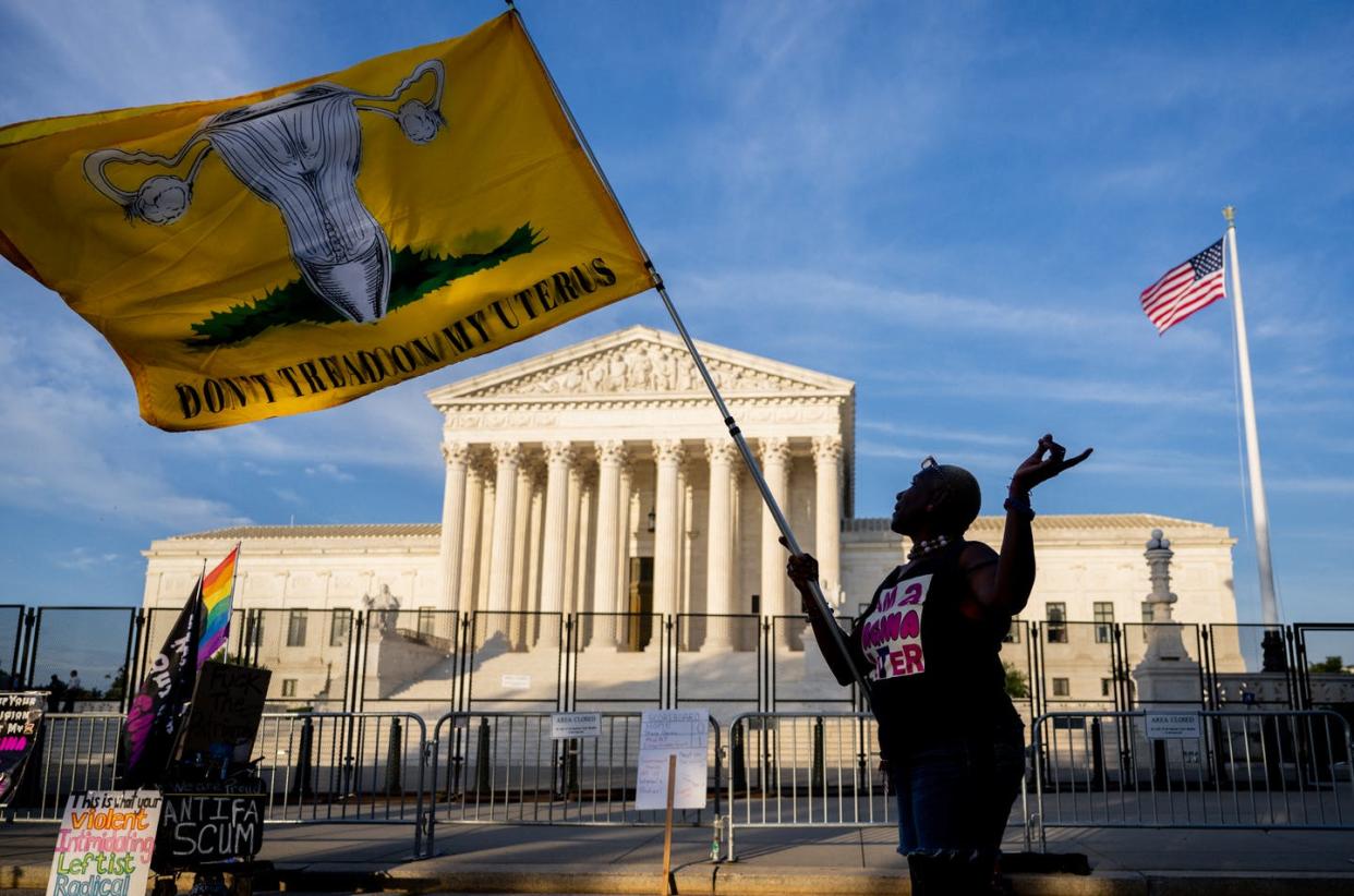 <span class="caption">A half-century of reproduction rights upended by the Supreme Court.</span> <span class="attribution"><a class="link " href="https://www.gettyimages.com/detail/news-photo/nadine-sciler-dances-in-front-of-the-u-s-supreme-court-news-photo/1404304559?adppopup=true" rel="nofollow noopener" target="_blank" data-ylk="slk:Brandon Bell/Getty Images;elm:context_link;itc:0;sec:content-canvas">Brandon Bell/Getty Images</a></span>