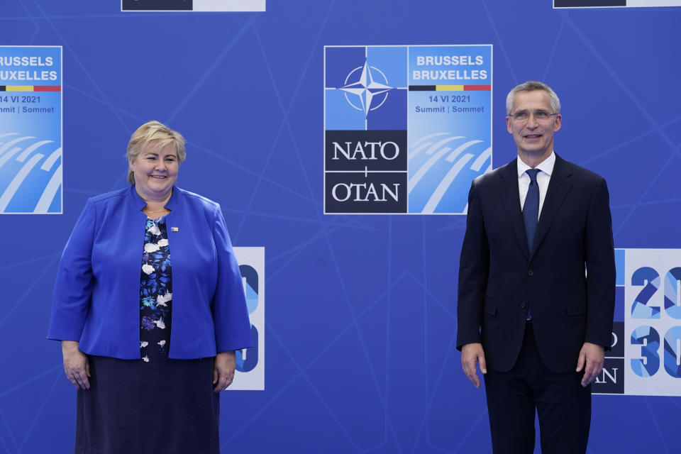 Norway's Prime Minister Erna Solberg poses for photos with with NATO Secretary General Jens Stoltenberg at the NATO summit at NATO headquarters in Brussels, Monday, June 14, 2021. (AP Photo/Patrick Semansky, Pool)