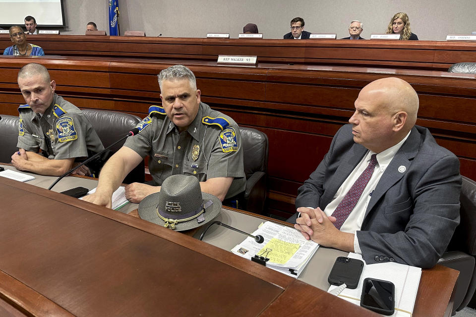FILE - Connecticut Department of Emergency Services and Public Protection Commissioner James Rovella, right, appears with Colonel Stavros Mellekas, superintendent of the Connecticut State Police, center, and Lt. Colonel Mark Davison for a hearing on state troopers providing false traffic stop information on Wednesday, July 26, 2023 in Hartford, Conn. Rovella and Mellekas will be stepping down in the middle of multiple investigations into whether troopers submitted bogus data on thousands of traffic stops that may have never happened, Gov. Ned Lamont announced Wednesday.(Susan Haigh/Associated Press, File)