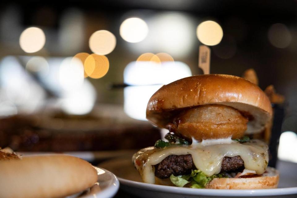 The Firehouse burger with pepper jack, jalapeños, onion rings, bacon and lettuce from the Black Bear restaurant in Irvine, Ky.