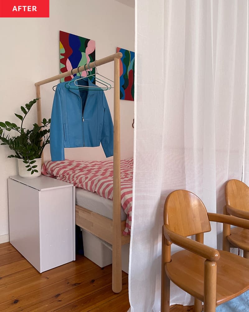 Curtain separating bedroom and living room in studio apartment.