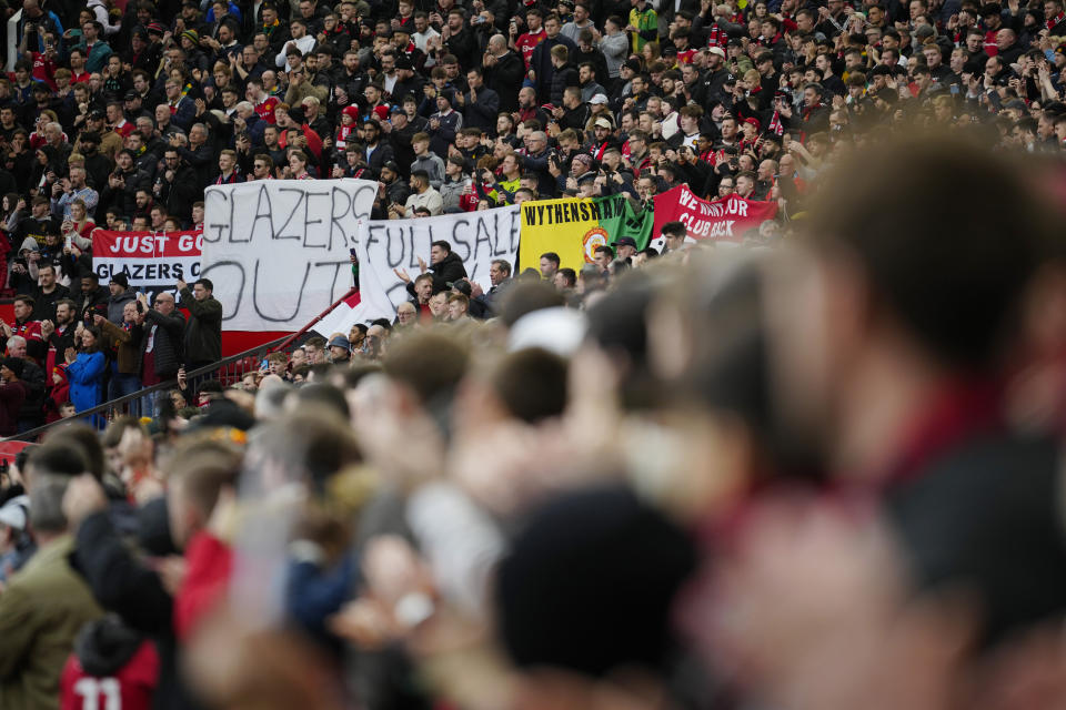 An anti-Glazer family banner is held up by members of the crowd before the English Premier League soccer match between Manchester United and Southampton at Old Trafford stadium in Manchester, England, Sunday, March 12, 2023. The Glazer family are the owners of Manchester United. (AP Photo/Jon Super)