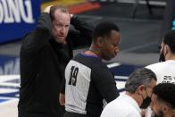 Toronto Raptors head coach Nick Nurse, left, motions his hands to his head in front of referee James Capers (19) after a flagrant call was made against forward Freddie Gillespie in the second half of an NBA basketball game against the Dallas Mavericks in Dallas, Friday, May 14, 2021. (AP Photo/Tony Gutierrez)