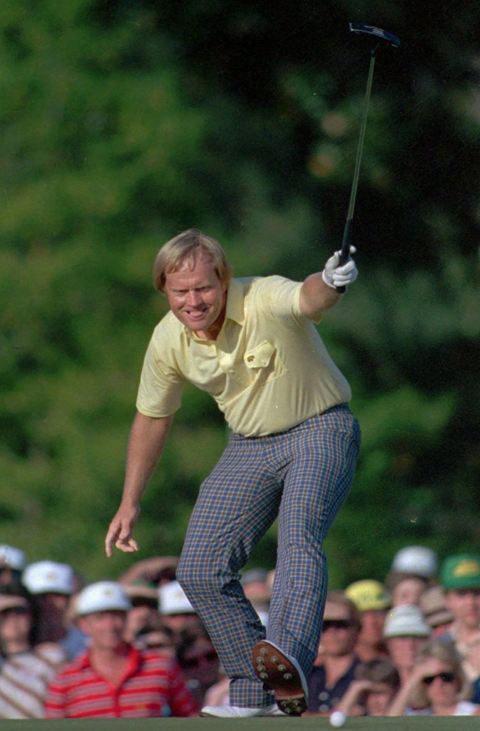 Jack Nicklaus takes pleasure in watching his putt drop for a birdie on the 17th hole at Augusta National in this April 13, 1986 file photo.