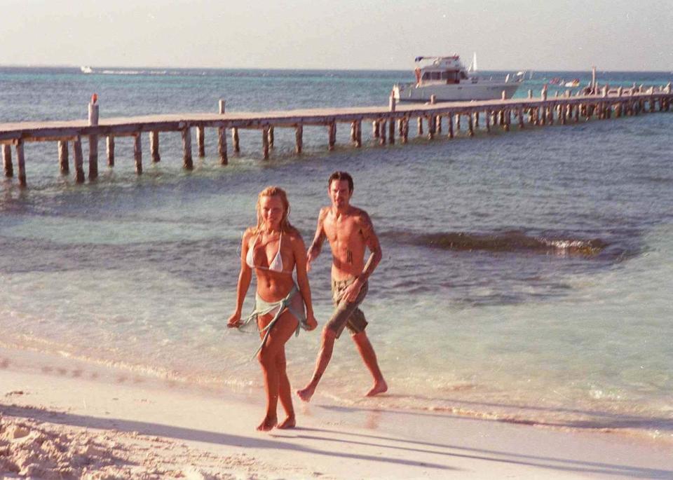 <p>Pamela Anderson and Tommy Lee on the beach following their February 1995 wedding in Cancun, Mexico.</p>