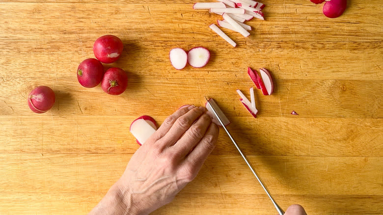 knife slicing radishes