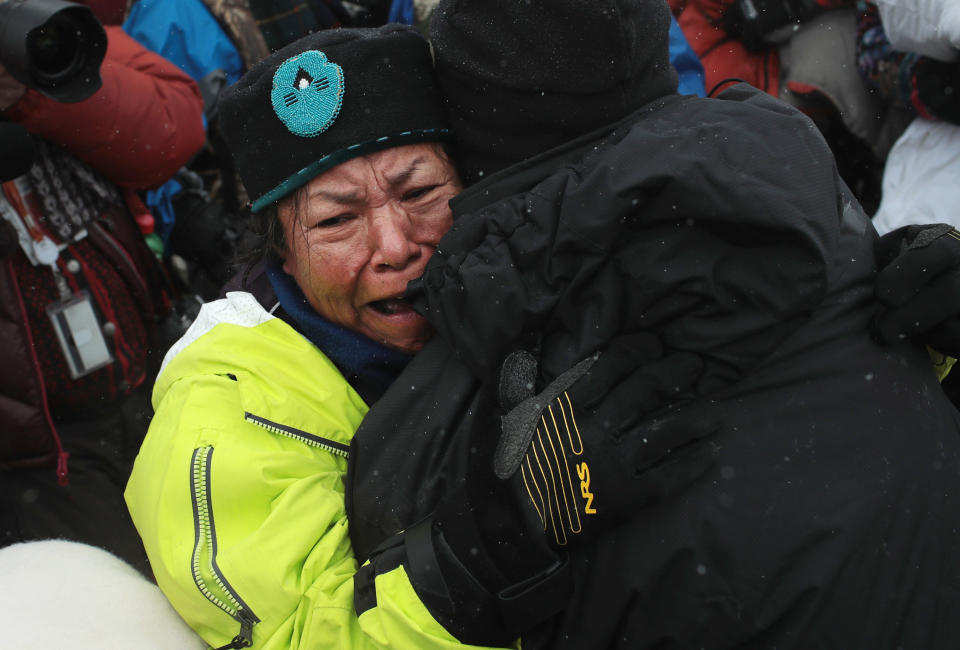 Patty Sam Porter of the Colville tribe in Washington state was welcomed after traveling from the headwaters of the Missouri River in a dugout canoe to join activists.