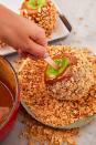 <p>Caramel apples are one of <a href="https://www.delish.com/fall-recipes/" rel="nofollow noopener" target="_blank" data-ylk="slk:fall's" class="link ">fall's</a> greatest pleasures, and they're also super-fun to personalize. We love toasted chopped peanuts, but you could dip your apples in pretty much anything: crushed cinnamon cereal, chopped Reese's Pieces, multicolored sprinkles, chopped <a href="https://www.delish.com/cooking/recipe-ideas/g2740/ways-to-use-oreos-recipes/" rel="nofollow noopener" target="_blank" data-ylk="slk:Oreos" class="link ">Oreos</a>... the list goes on and on.<br><br>Get the <strong><a href="https://www.delish.com/holiday-recipes/halloween/g696/how-to-make-caramel-apples/" rel="nofollow noopener" target="_blank" data-ylk="slk:Caramel Apples recipe" class="link ">Caramel Apples recipe</a></strong>.</p>