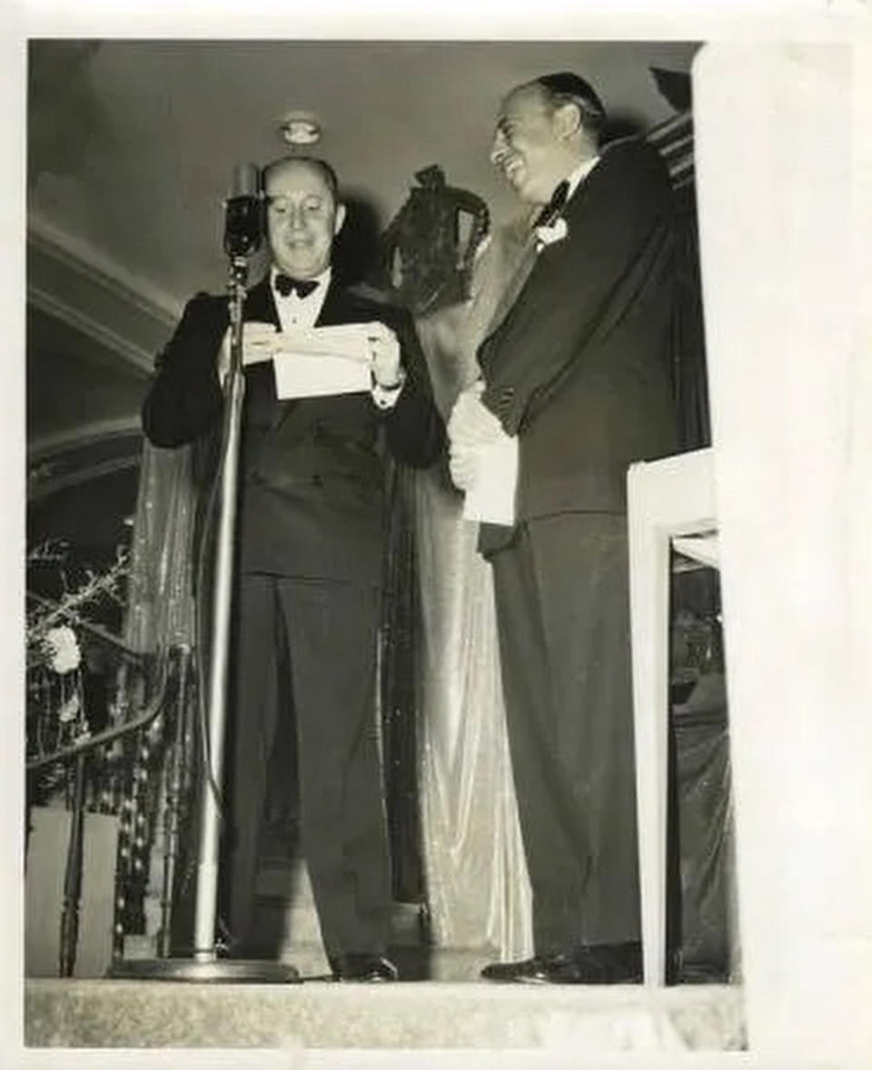 Christian Dior accepting the Neiman Marcus Award from Stanley Marcus in 1947.