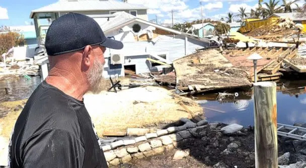 PHOTO: John Lynch looks at his uncle's house that was destroyed during Hurricane Ian, in Matlacha, Fla. (Miles Cohen/ABC News)