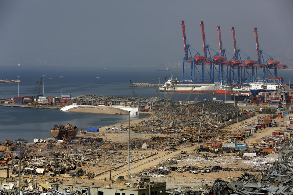 The port area lies in devastation following this week's massive explosion in the port of Beirut, Lebanon, Friday, Aug. 7, 2020. Rescue teams were still searching the rubble of Beirut's port for bodies on Friday, nearly three days after a massive explosion sent a wave of destruction through Lebanon's capital. (AP Photo/Thibault Camus)