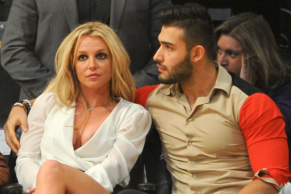 Britney Spears and Sam Asghari attend a basketball game between the Los Angeles Lakers and the Golden State Warriors