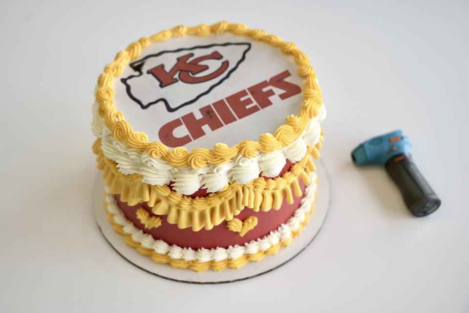 A Kansas City Chiefs-themed "burn away cake" is displayed in Coon Rapids, Minn., Monday, Feb. 5, 2024. Maddie Schmitz, owner of Something Sweet by Maddie Lu, created the Taylor Swift/Travis Kelce cakes just in time for NFL football's upcoming Super Bowl. (AP Photo/Mark Vancleave)