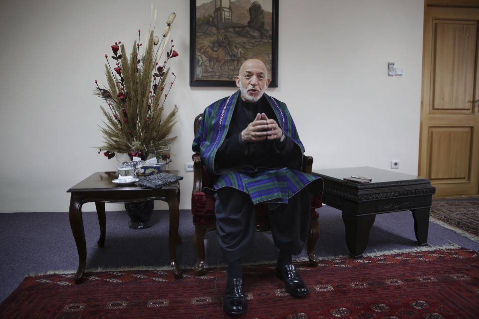 Former Afghan President Hamid Karzai speaks during an interview with The Associated Press, in Kabul, Afghanistan, Tuesday, Dec. 10, 2019. Karzai, whose final years in power were characterized by a cantankerous relationship with the United States, said on Tuesday that Washington used blackmail and corruption to manipulate his officials, undermine his government and foment violence among the country's many factions. (AP Photo/Altaf Qadri)