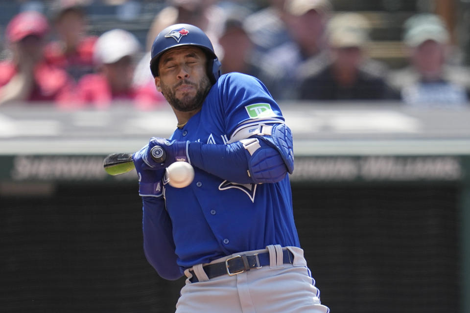 Toronto Blue Jays' George Springer backs away from a pitch in the seventh inning of a baseball game against the Cleveland Guardians, Thursday, Aug. 10, 2023, in Cleveland. (AP Photo/Sue Ogrocki)