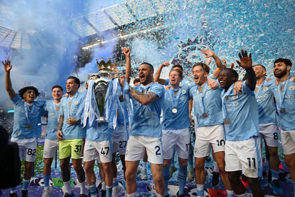 Kyle Walker lifts the Premier League trophy for Manchester City (Getty Images)